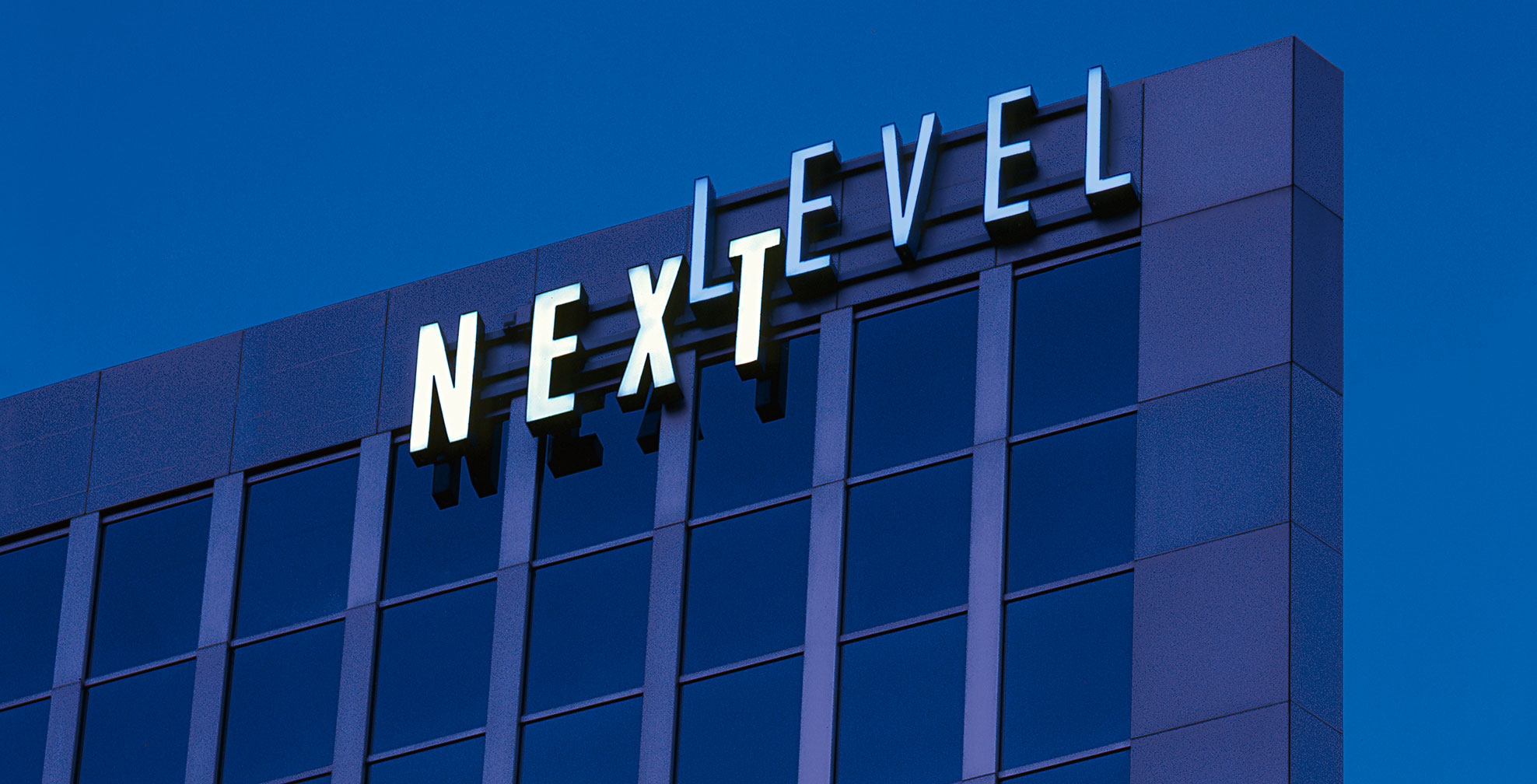 next-level-systems_night-sign.jpg Art Direction by: Bart Crosby, Crosby Associates